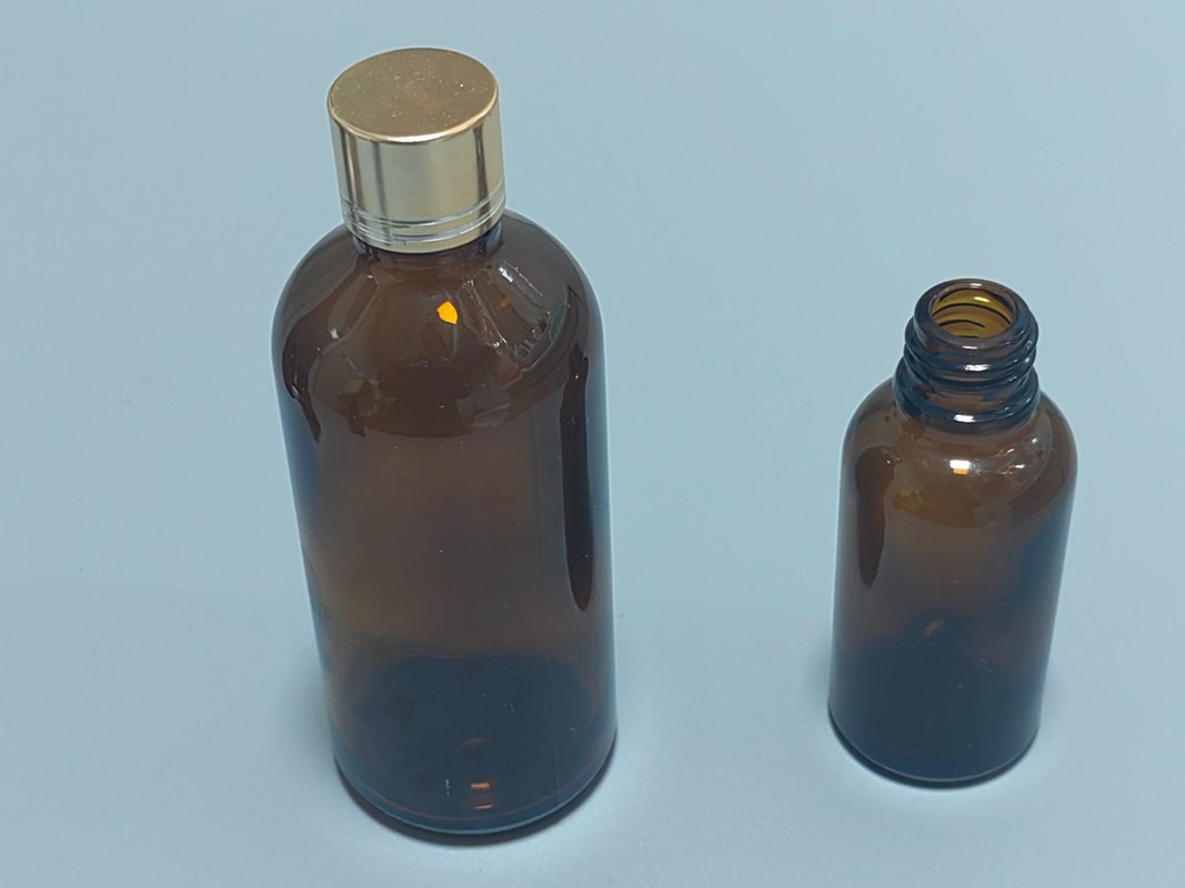 Opakowanie oleju eterycznego 1OZ 2OZ 20ml 30ml 50ml surowiec z oleju eterycznego bursztynowego Szklana butelka kroplówkowa z dziecięco zabezpieczoną czapką